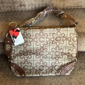 Brand new Coach purse with plastic on strap and original Coach tag